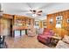 Inviting living room with built-in shelving and casual seating area next to the dining space at 585 Cokesbury Rd, Fuquay Varina, NC 27526