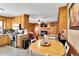 Open kitchen and living area featuring wood paneling and modern appliances at 585 Cokesbury Rd, Fuquay Varina, NC 27526