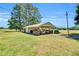 Spacious outbuilding with covered storage and ample space for projects and equipment at 585 Cokesbury Rd, Fuquay Varina, NC 27526
