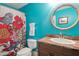 Bright bathroom with bold, colorful design elements and a shower curtain at 639 Cedar Grove Rd, Pittsboro, NC 27312