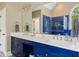 Bright bathroom with double sinks, modern cabinets, and a tiled shower reflecting in the mirror at 639 Cedar Grove Rd, Pittsboro, NC 27312