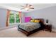 Bedroom featuring a large window, neutral carpet, and an accent wall at 639 Cedar Grove Rd, Pittsboro, NC 27312