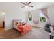 Bright bedroom with two windows, plush carpeting, and a pink bed at 639 Cedar Grove Rd, Pittsboro, NC 27312