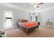 Bright bedroom with a ceiling fan, an outdoor access door, and natural light at 639 Cedar Grove Rd, Pittsboro, NC 27312