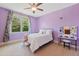This bedroom features a large window and a lighted vanity at 639 Cedar Grove Rd, Pittsboro, NC 27312