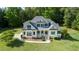 Beautiful two-story home featuring a lush lawn and charming front porch with inviting curb appeal at 639 Cedar Grove Rd, Pittsboro, NC 27312