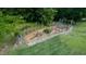 Elevated view of garden featuring raised beds, stone paths, and lush greenery at 639 Cedar Grove Rd, Pittsboro, NC 27312