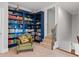Cozy home library with custom, floor-to-ceiling blue bookcase at 639 Cedar Grove Rd, Pittsboro, NC 27312