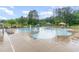 Large community pool featuring plenty of seating and a lifeguard stand at 646 Shelford Trl, Zebulon, NC 27597