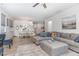 Open-concept living and dining area featuring stylish furnishings and plenty of natural light at 646 Shelford Trl, Zebulon, NC 27597