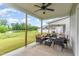 Relaxing covered patio with a ceiling fan, patio furniture, and a view of the lawn at 646 Shelford Trl, Zebulon, NC 27597