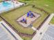 Aerial view of the fenced in community playground at 646 Shelford Trl, Zebulon, NC 27597