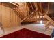 Spacious unfinished attic with exposed wood beams offering potential for future expansion at 7116 Dumfries Ln, Chapel Hill, NC 27514