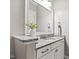 Neutral bathroom with granite counters and white cabinets at 7116 Dumfries Ln, Chapel Hill, NC 27514