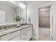 Elegant bathroom with double vanity, granite countertop, and tiled shower at 7116 Dumfries Ln, Chapel Hill, NC 27514
