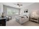 Inviting bedroom with ample natural light, ceiling fan, and contemporary decor at 7116 Dumfries Ln, Chapel Hill, NC 27514
