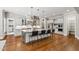 Gorgeous kitchen features a large island with seating and stainless steel appliances at 7116 Dumfries Ln, Chapel Hill, NC 27514