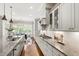 Modern kitchen featuring stainless steel appliances, granite countertops, and ample cabinet space at 7116 Dumfries Ln, Chapel Hill, NC 27514