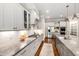 Well-equipped kitchen with stainless steel appliances, granite countertops and hardwood flooring at 7116 Dumfries Ln, Chapel Hill, NC 27514