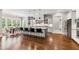 Spacious kitchen features a large center island with bar stools and stainless steel appliances at 7116 Dumfries Ln, Chapel Hill, NC 27514