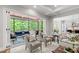 Living room with comfortable seating, screened porch and an open floor plan at 7116 Dumfries Ln, Chapel Hill, NC 27514