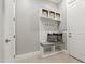 Mudroom featuring custom bench, storage and coat hooks at 7116 Dumfries Ln, Chapel Hill, NC 27514