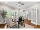 Bright office with hardwood floors, large windows, and French doors leading to another room at 7116 Dumfries Ln, Chapel Hill, NC 27514