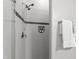 Modern shower with sleek tiling, niche shelving, and a dual showerhead at 7116 Dumfries Ln, Chapel Hill, NC 27514