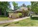 A nice exterior view of the house with a well-maintained lawn and mature trees in a desirable neighborhood at 75 Stone Hill Ct, Durham, NC 27704