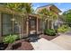Inviting front entrance with a glass door and neutral toned exterior with tasteful landscaping at 75 Stone Hill Ct, Durham, NC 27704