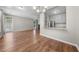 Open concept living room featuring hardwood floors and lots of natural light with a bar height pass through to the kitchen at 75 Stone Hill Ct, Durham, NC 27704