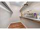 Well-organized walk-in closet with shelving, providing ample storage space for clothes and accessories at 75 Stone Hill Ct, Durham, NC 27704