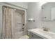 Bathroom with a shower/tub combination and a stylish gray vanity with a modern sink at 7824 Hemlock Ct, Raleigh, NC 27615