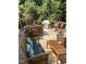 Spacious wooden deck with ample seating and a grill, perfect for outdoor dining and entertaining in a serene setting at 7824 Hemlock Ct, Raleigh, NC 27615