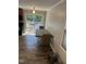 Bright dining area with a sliding glass door to the deck and views of the pool and backyard at 7824 Hemlock Ct, Raleigh, NC 27615