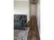 Inviting hallway with wood-look flooring and neutral paint, leading to various rooms in the home at 7824 Hemlock Ct, Raleigh, NC 27615