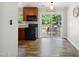 Well-appointed kitchen with stainless steel appliances and a sliding glass door leading to the backyard deck at 7824 Hemlock Ct, Raleigh, NC 27615