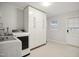 Laundry room features full size washer and dryer with lots of storage cabinets at 7824 Hemlock Ct, Raleigh, NC 27615