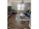 Comfortable living room features a plush sofa, stylish decor, and natural light, creating an inviting and relaxing atmosphere at 7824 Hemlock Ct, Raleigh, NC 27615