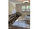 Well-lit living room with neutral walls, plush rug, and comfortable seating, perfect for relaxation and entertaining guests at 7824 Hemlock Ct, Raleigh, NC 27615