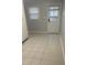 Mud room features tiled floor, backdoor with glass insert, and additional natural light at 7824 Hemlock Ct, Raleigh, NC 27615