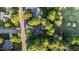 Top-down aerial reveals this home's wooded surroundings near the golf course and quiet neighborhood streets at 905 Neuse Ridge Dr, Clayton, NC 27527
