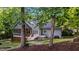 Relaxing backyard with screened porch, deck with hot tub, and a hammock between mature trees at 905 Neuse Ridge Dr, Clayton, NC 27527