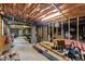 Unfinished basement provides ample space for storage or customization with exposed beams and concrete foundation at 905 Neuse Ridge Dr, Clayton, NC 27527
