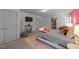 Inviting bedroom with a cozy rug, books, and natural light streaming in from the window at 905 Neuse Ridge Dr, Clayton, NC 27527