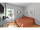 Cozy bedroom featuring hardwood floors, natural light, neutral walls and simple decor at 905 Neuse Ridge Dr, Clayton, NC 27527