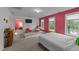 Bedroom featuring a cozy seating area and ample natural light from several windows at 905 Neuse Ridge Dr, Clayton, NC 27527