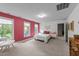 Bedroom featuring a cozy seating area and ample natural light from several windows at 905 Neuse Ridge Dr, Clayton, NC 27527
