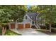 Charming two-story home with a three-car garage and well-manicured landscaping, nestled among mature trees at 905 Neuse Ridge Dr, Clayton, NC 27527