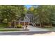 Attractive two-story home with a well-kept lawn, mature trees, and an attached two-car garage at 905 Neuse Ridge Dr, Clayton, NC 27527